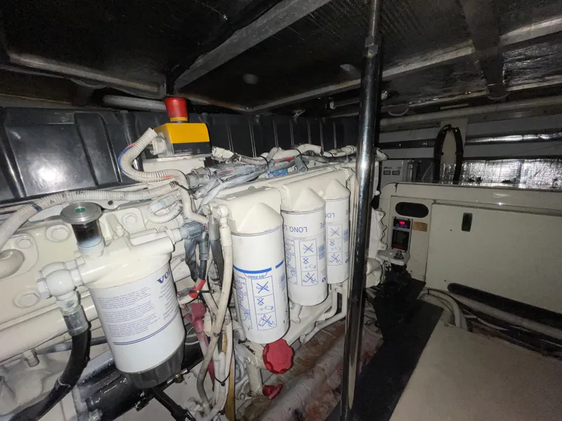 Slide: The Image of Engine room of a 2005 Carver 56 Voyager yacht, showcasing filters and mechanical components. - 45