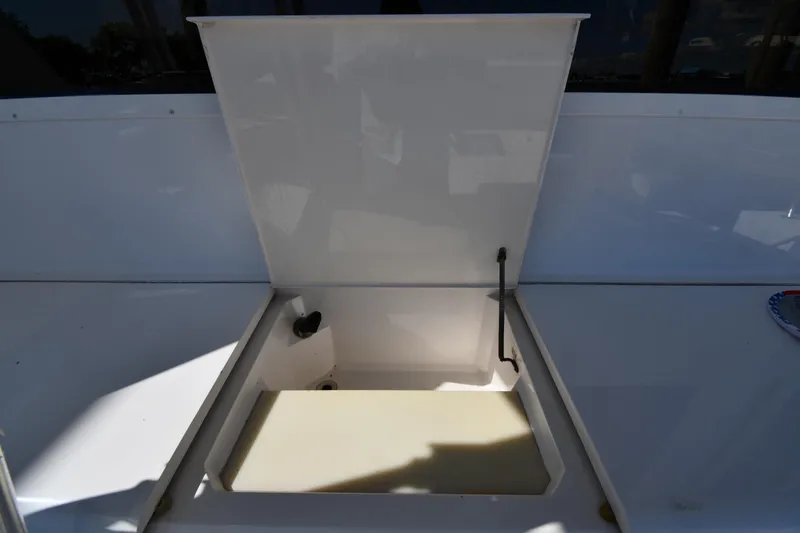 Slide: The Image of Open storage compartment on a 1996 Viking 53 Convertible yacht deck. - 13