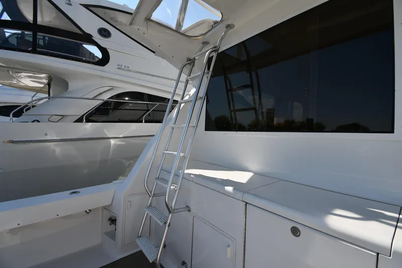 Slide: The Image of 1996 Viking 53 Convertible yacht with sleek exterior and ladder. - 17