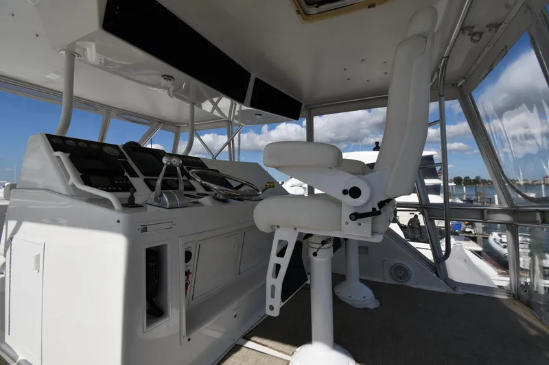 Slide: The Image of Interior view of 1996 Viking 53 Convertible yacht helm with captain's chair and controls. - 22