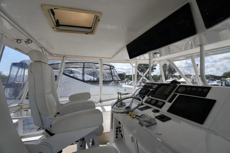 Slide: The Image of Interior view of 1996 Viking 53 Convertible yacht cockpit with steering and control panels. - 23