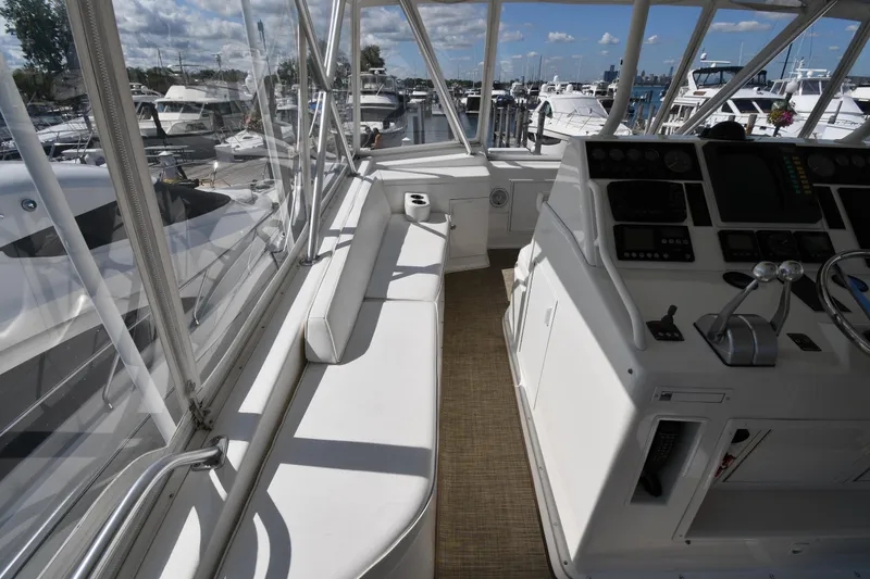 Slide: The Image of Interior view of 1996 Viking 53 Convertible yacht with helm and seating area. - 24