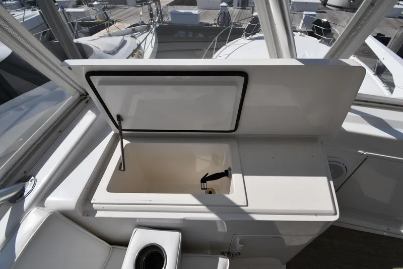 Slide: The Image of Open storage compartment on 1996 Viking 53 Convertible yacht deck. - 28