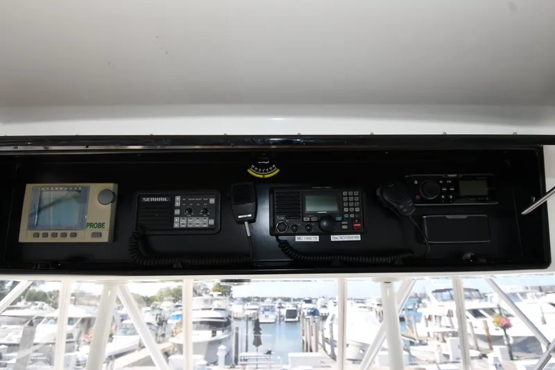 Slide: The Image of 1996 Viking 53 Convertible yacht dashboard with navigation and communication equipment. - 30