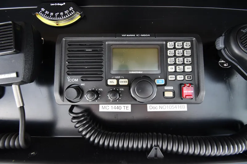 Slide: The Image of VHF marine radio on 1996 Viking 53 Convertible boat dashboard. - 32