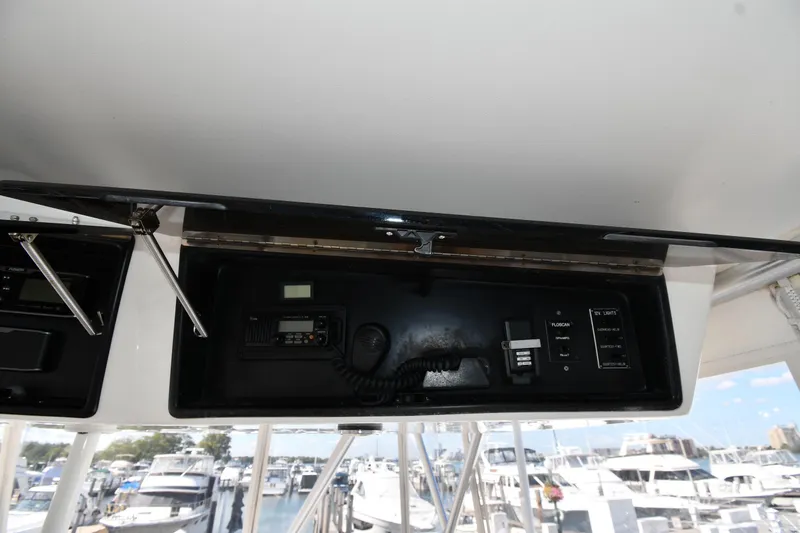 Slide: The Image of 1996 Viking 53 Convertible yacht control panel with radio and switches. - 35