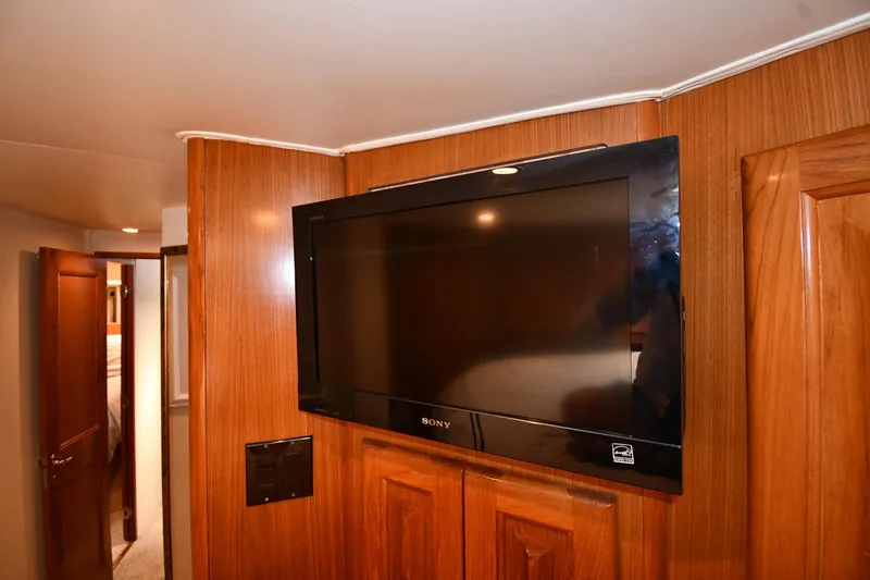 Slide: The Image of Wall-mounted Sony TV in 1996 Viking 53 Convertible yacht interior. - 45
