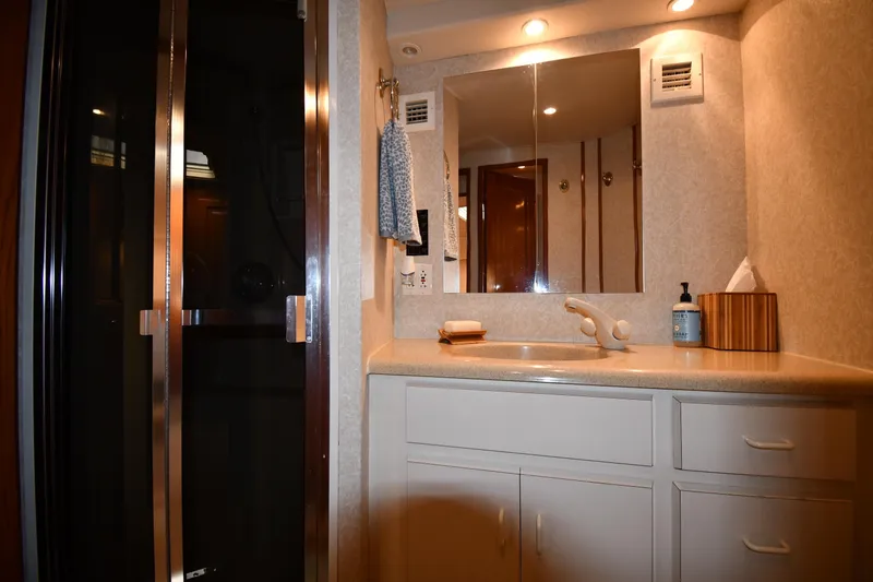 Slide: The Image of Bathroom interior of 1996 Viking 53 Convertible yacht with shower and vanity. - 49