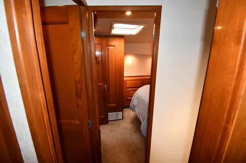 Slide: The Image of Interior view of 1996 Viking 53 Convertible yacht cabin with wooden finish. - 54