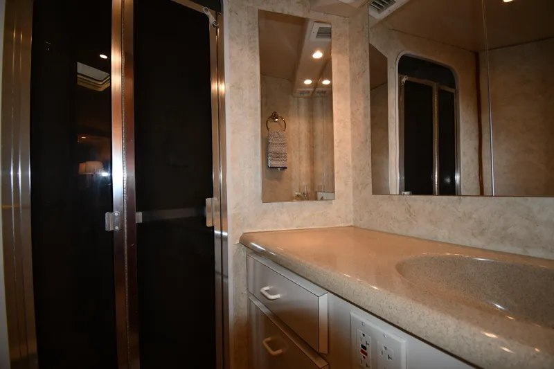 Slide: The Image of Bathroom interior of 1996 Viking 53 Convertible yacht with modern fixtures and lighting. - 62