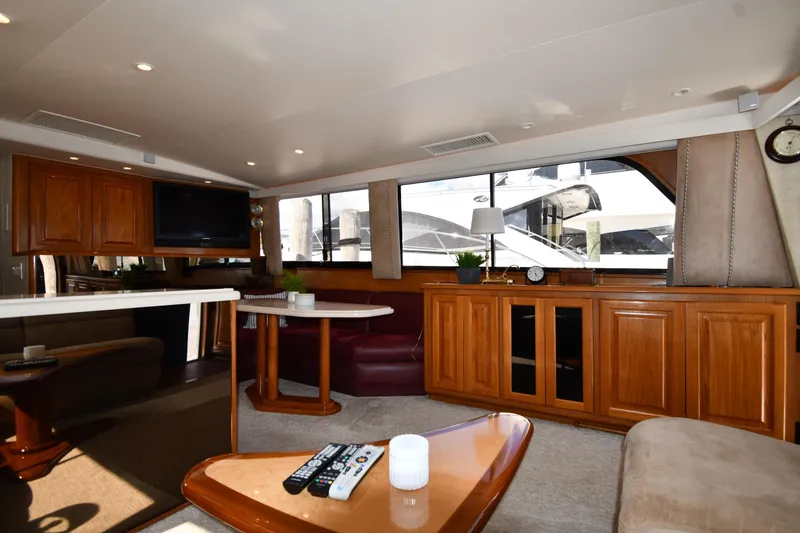 Slide: The Image of Luxurious interior of a 1996 Viking 53 Convertible yacht with elegant wood cabinetry. - 66