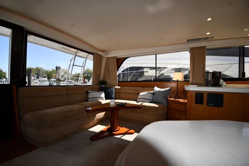 Slide: The Image of Luxurious interior of a 1996 Viking 53 Convertible yacht with plush seating and elegant decor. - 68