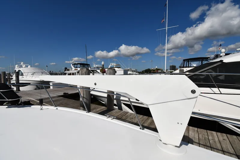 Slide: The Image of 1996 Viking 53 Convertible yacht docked at marina under clear blue sky. - 7