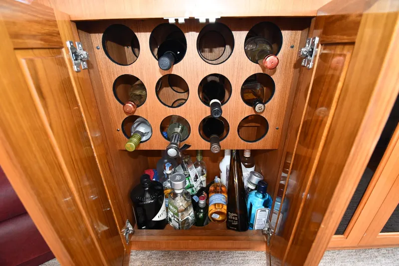 Slide: The Image of Wine and liquor cabinet inside a 1996 Viking 53 Convertible yacht. - 78
