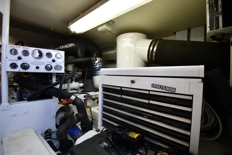 Slide: The Image of Engine room of 1996 Viking 53 Convertible with Craftsman tool chest and control panel. - 85