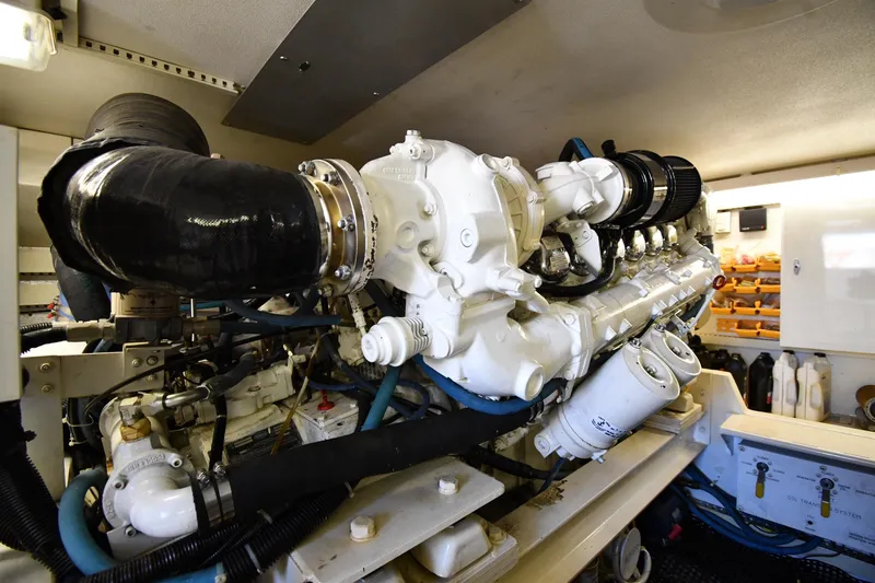 Slide: The Image of Engine room of a 1996 Viking 53 Convertible yacht, showcasing detailed machinery. - 91