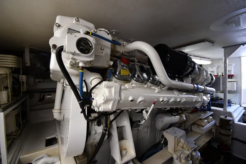 Slide: The Image of Engine room of a 1996 Viking 53 Convertible yacht, showcasing detailed machinery. - 95