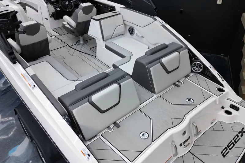 Slide: The Image of 2024 Yamaha Boats 252XE interior with modern seating and sleek design. - 12