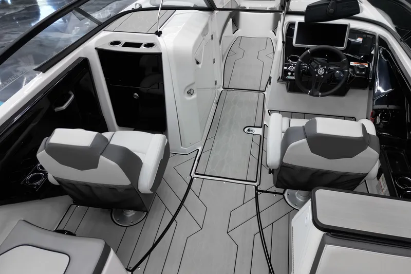 Slide: The Image of 2024 Yamaha Boats 252XE interior with modern helm, seating, and sleek design. - 15