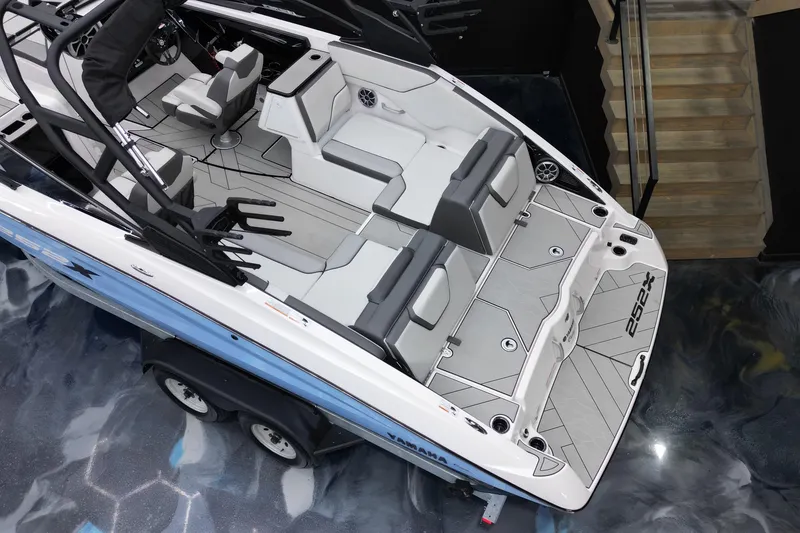 Slide: The Image of 2024 Yamaha Boats 252XE interior, showcasing sleek seating and modern design. - 16