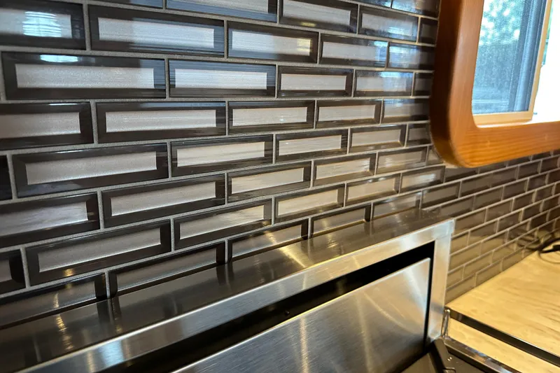 Slide: The Image of Modern kitchen backsplash with sleek rectangular tiles in Kadey-Krogen 44AE yacht, 2021 model. - 11