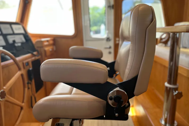 Slide: The Image of Luxurious interior of 2021 Kadey-Krogen 44AE yacht with plush seating and wooden accents. - 14