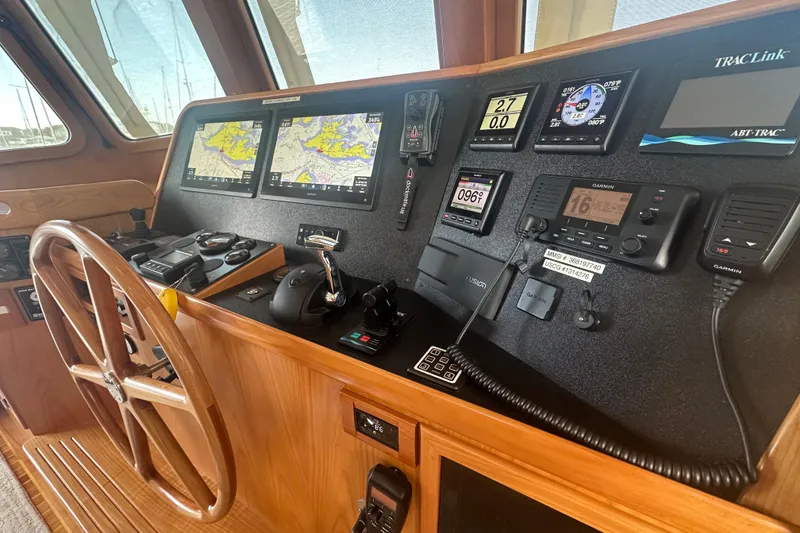 Slide: The Image of Kadey-Krogen 44AE 2021 helm with navigation and communication equipment. - 16