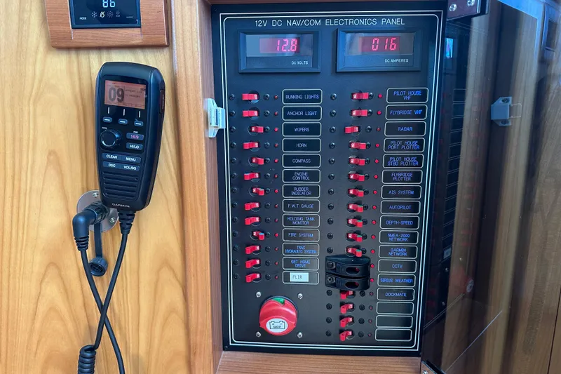 Slide: The Image of Kadey-Krogen 44AE 2021 electronics panel with navigation controls and communication device. - 18