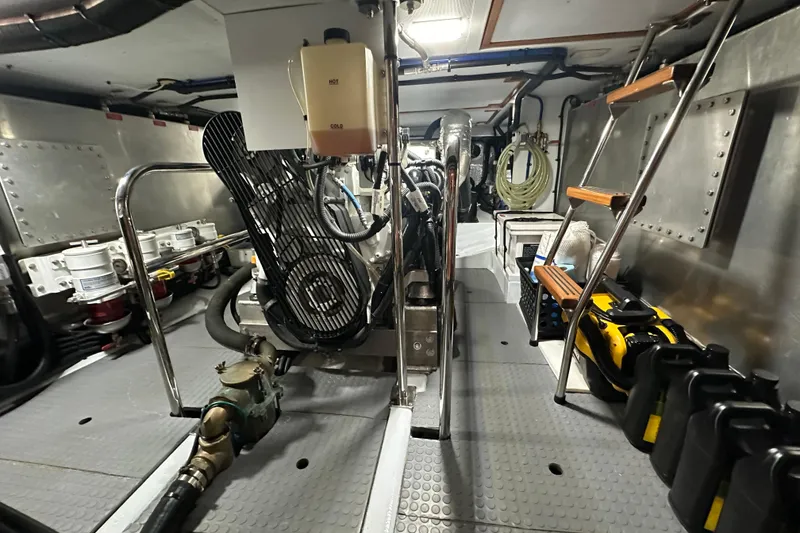 Slide: The Image of Engine room of 2021 Kadey-Krogen 44AE yacht, featuring machinery and storage. - 33
