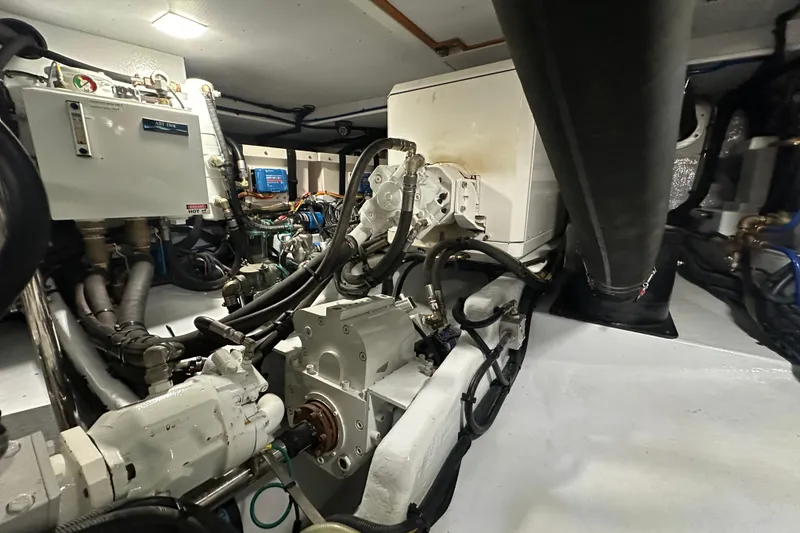 Slide: The Image of Engine room of 2021 Kadey-Krogen 44AE yacht, showcasing mechanical components and systems. - 36