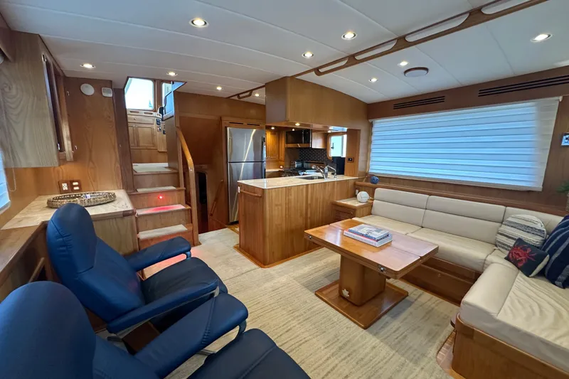 Slide: The Image of Luxurious interior of 2021 Kadey-Krogen 44AE yacht with modern kitchen and seating area. - 4