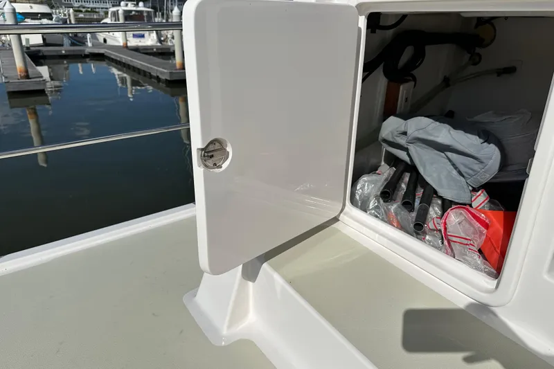 Slide: The Image of Open storage compartment on 2021 Kadey-Krogen 44AE yacht, docked at marina. - 48