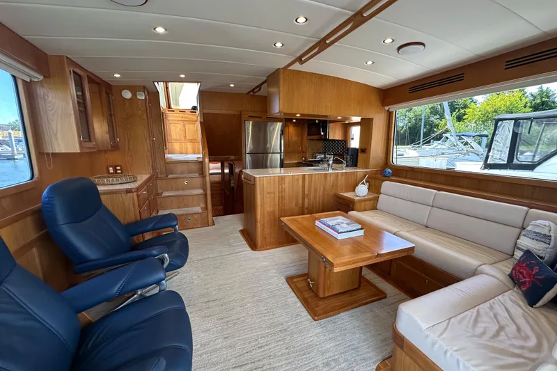 Slide: The Image of Luxurious interior of 2021 Kadey-Krogen 44AE yacht with elegant wood finishes and comfortable seating. - 5