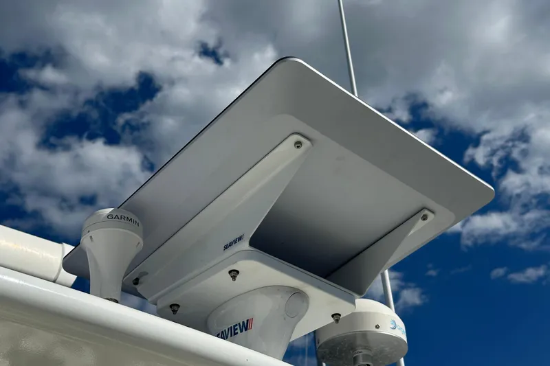 Slide: The Image of Radar and communication equipment on 2021 Kadey-Krogen 44AE yacht under a cloudy sky. - 51