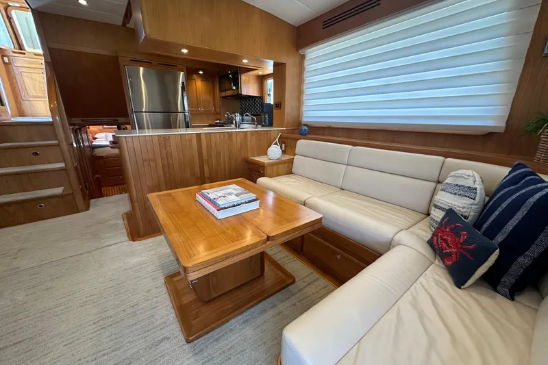 Slide: The Image of Luxurious interior of 2021 Kadey-Krogen 44AE yacht with modern kitchen and cozy seating area. - 6