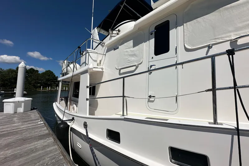 Slide: The Image of 2021 Kadey-Krogen 44AE yacht docked, showcasing sleek design and modern features. - 60