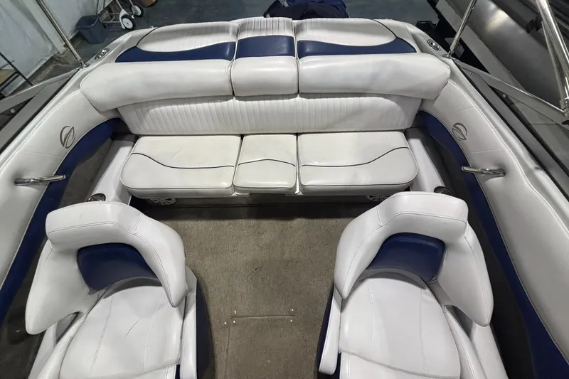 Slide: The Image of 2013 Crownline 185 SS boat interior with white and blue seating arrangement. - 10