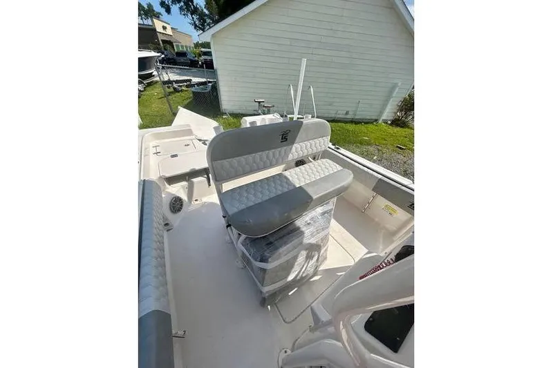 Slide: The Image of 2026 Carolina Skiff 21 Ultra Elite boat interior with cushioned seating and storage. - 4