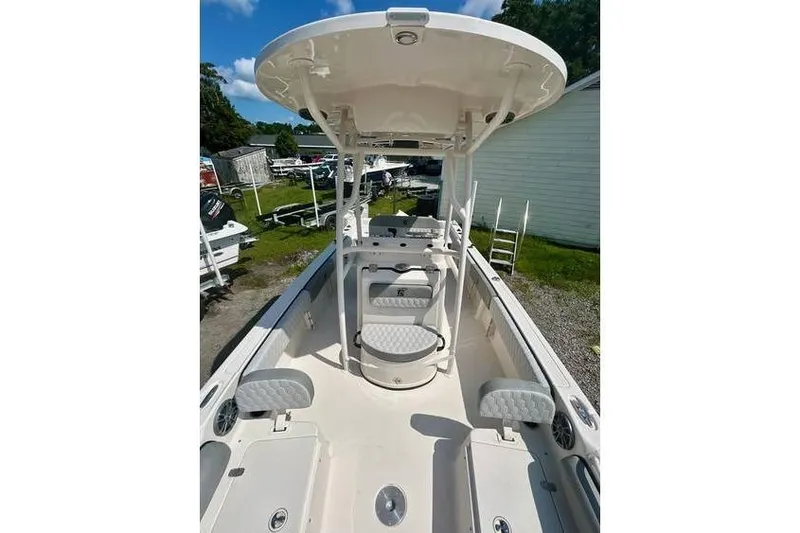 Slide: The Image of 2026 Carolina Skiff 21 Ultra Elite boat interior with seating and console. - 5