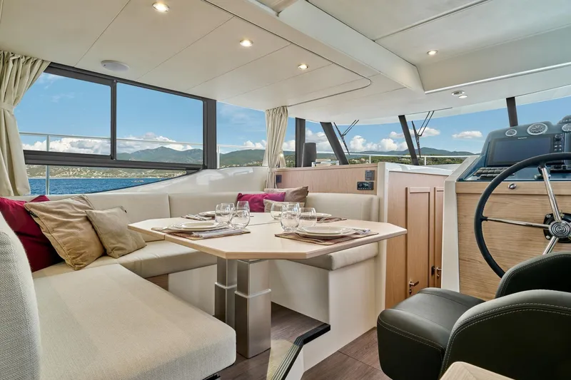 Slide: The Image of Luxurious interior of 2026 Beneteau Swift Trawler 48 with elegant dining area. - 1