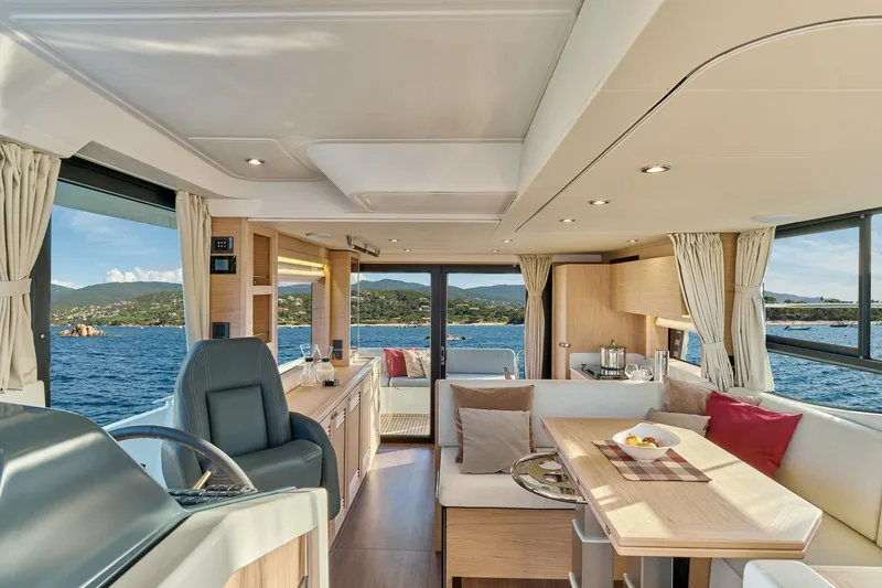 Slide: The Image of Luxurious interior of 2026 Beneteau Swift Trawler 48 with scenic ocean view. - 5