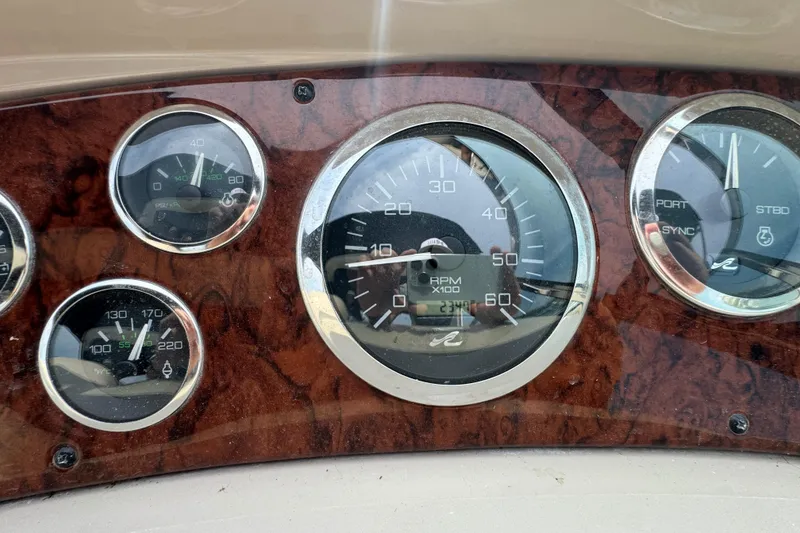 Slide: The Image of Dashboard gauges of a 2000 Sea Ray 380 Sundancer boat. - 17