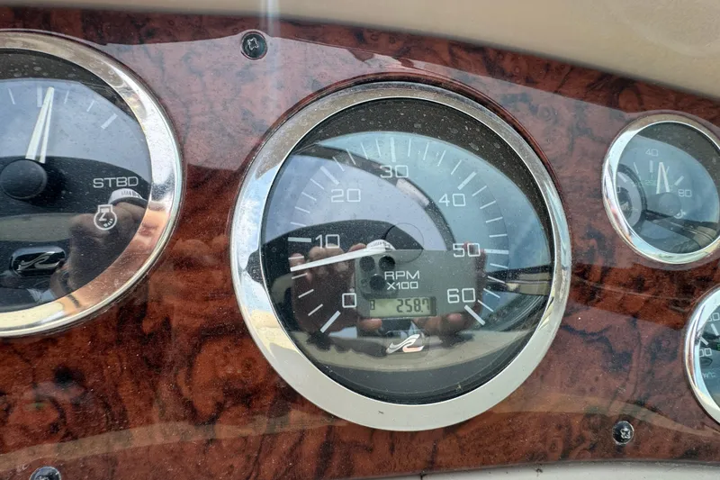 Slide: The Image of Dashboard of a 2000 Sea Ray 380 Sundancer boat showing RPM gauges. - 18