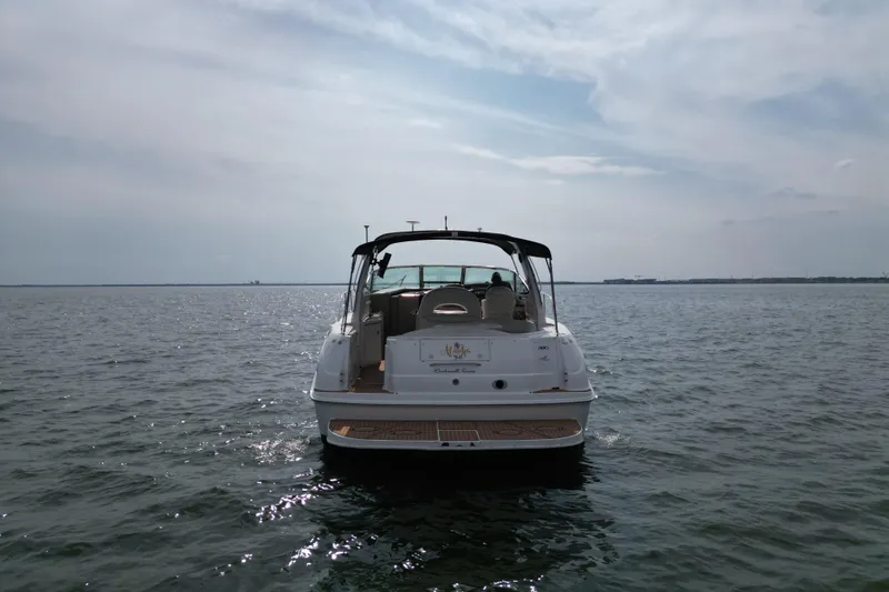 Slide: The Image of Sea Ray 380 Sundancer 2000 yacht on calm waters under cloudy sky. - 2