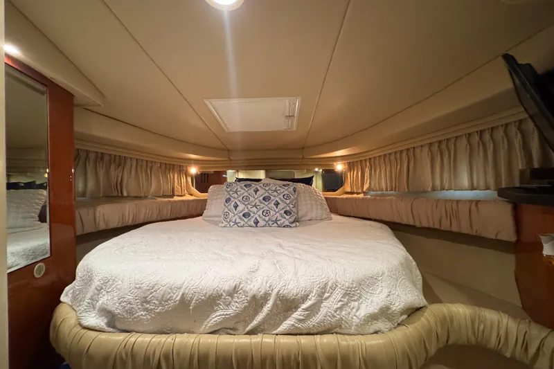 Slide: The Image of Luxurious cabin interior of 2000 Sea Ray 380 Sundancer with cozy bedding. - 26