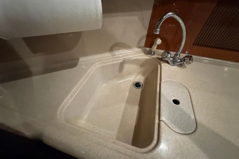 Slide: The Image of Kitchen sink and faucet in 2000 Sea Ray 380 Sundancer yacht. - 36