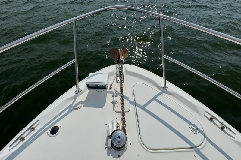 Slide: The Image of Bow of 2000 Sea Ray 380 Sundancer yacht with anchor chain and railing. - 8