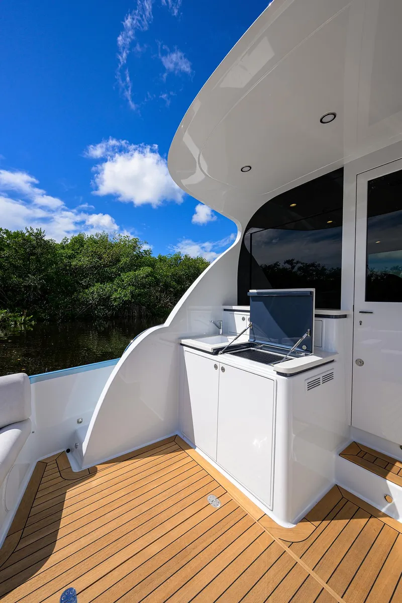 Slide: The Image of 2024 Palm Beach Motor Yachts GT50 deck with sleek design and modern amenities. - 21
