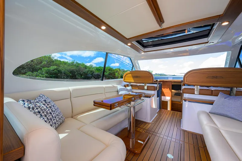 Slide: The Image of Luxurious interior of 2024 Palm Beach Motor Yachts GT50 with elegant seating and wood accents. - 34