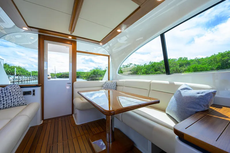 Slide: The Image of Luxurious interior of 2024 Palm Beach Motor Yachts GT50 with elegant seating and wooden accents. - 38